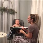 Baby laughs hysterically as mother fake sneezes.