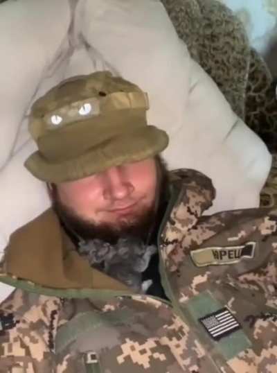 Ukraine Defender's with their furry cat volunteers. 
