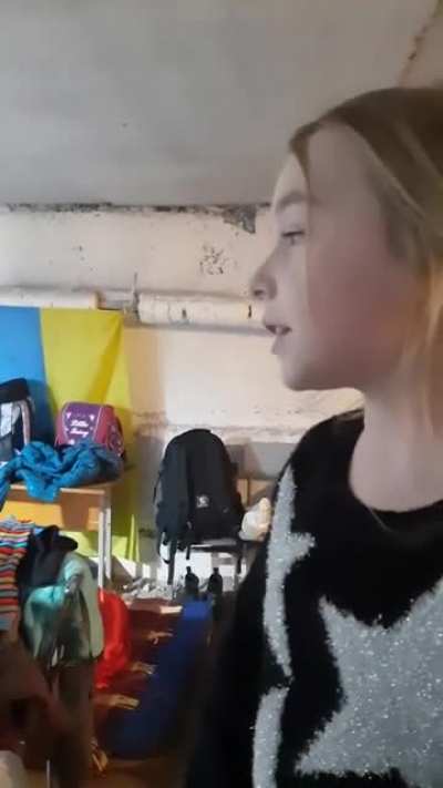 A girl sing a song in a shelter