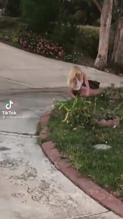 Girl skateboarding down hill