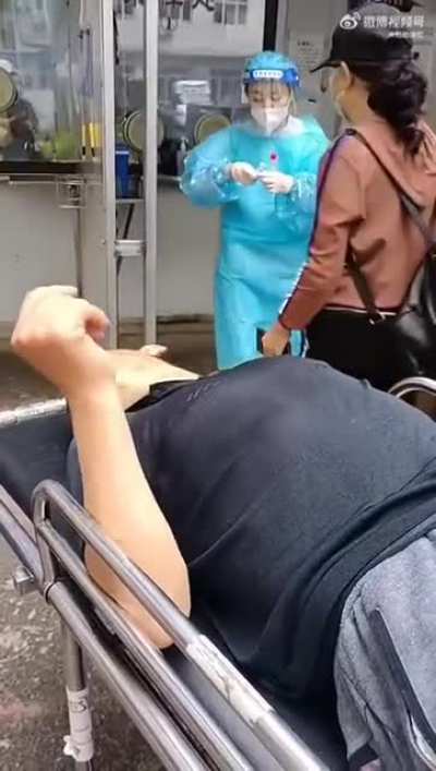 China's inhumane pandemic rules mean patients must clear covid tests before they are admitted for treatment. In this video, a man in Dandong has just had a stroke but precious time is lost on administering the test. The unfortunate ones die before test re
