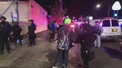 Woman brings her kid to Portland protest after riot has been declared multiple times - day 74