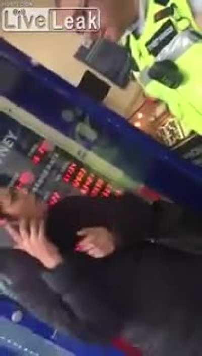 Woman gets mad while being asked to move away from the door. The guard responds 