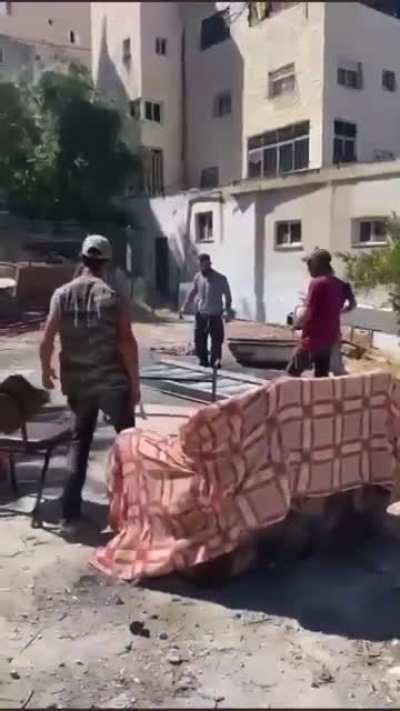 Israeli Settlers break into this women’s land in Silwan and start installing a staircase under the protection of their army