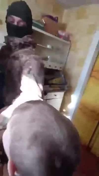 UA POV: Man resisting mobilization in Ukraine as wife and child look on.