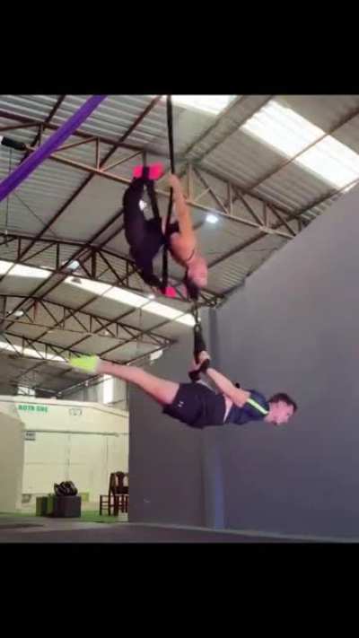 There's so much going on in this gif. One thing for certain is that someone is hanging by their hair.