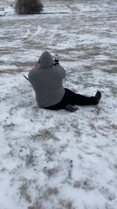 Dog gets excited about the snow and pulls guy down the hill