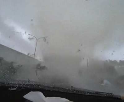 White car cuts off driver and gets swallowed by a tornado