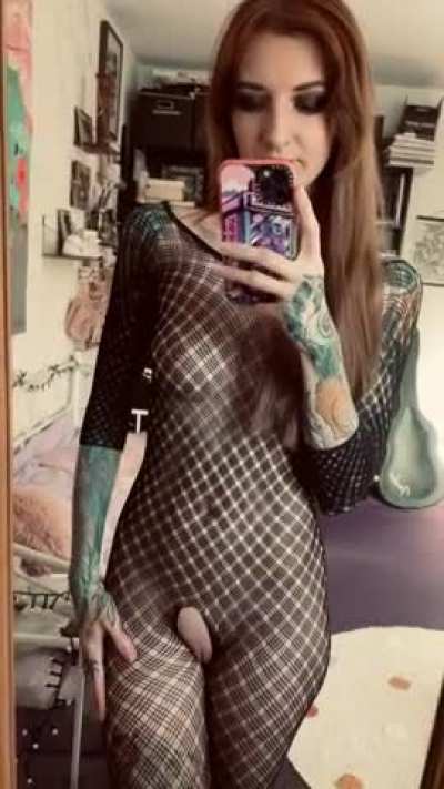 inked catsuit doll shows pussy