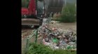 Instead of removing the trash, they place it back in the river so it won’t clog up.