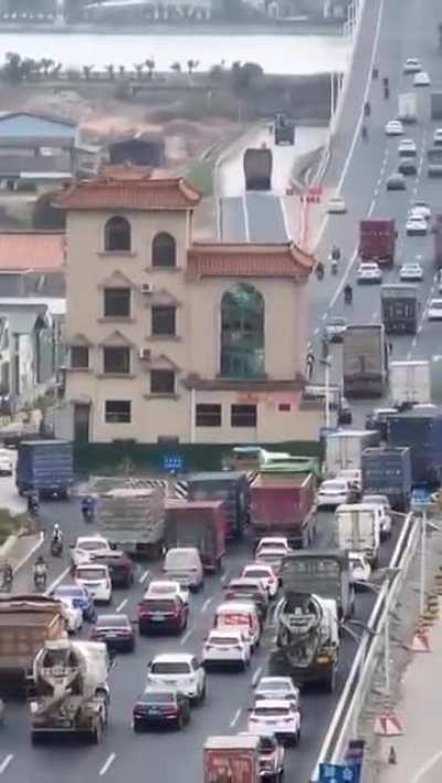 A house in the middle of the street.