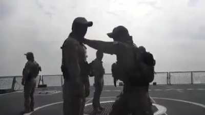 South Korean marines demonstrate close combat techniques aboard ship.