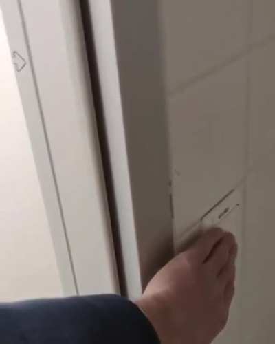 To flush the urinal, turn on the light switch in the stall. It's not my job to install buttons!