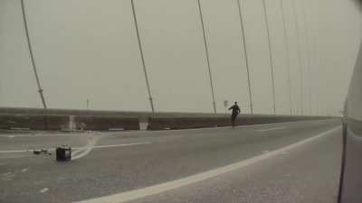 Man narrowly misses being struck by cement truck on Port Mann Bridge in Vancouver