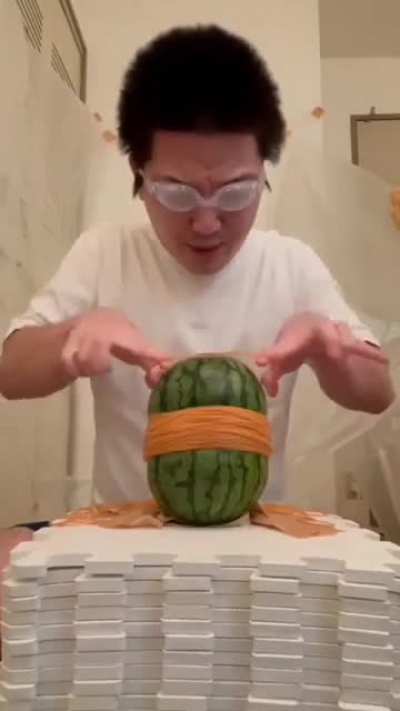Playing with rubber band and watermelon