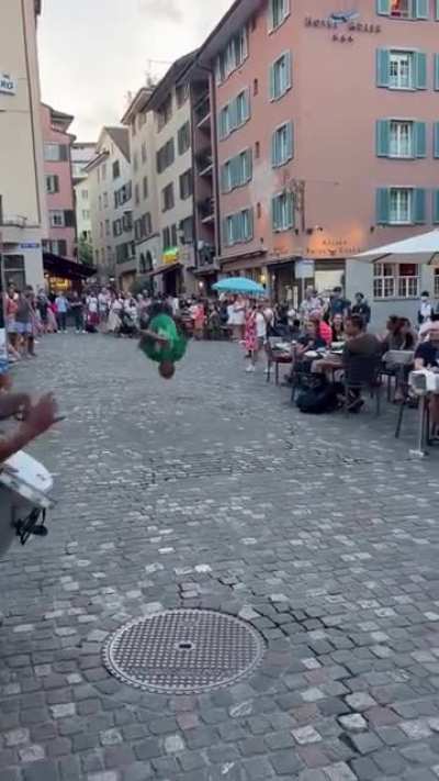 Guys flips multiple times and super high in front of crowd