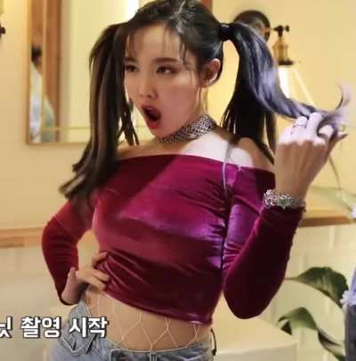Nayeon - pigtails, maroon red top, jeans