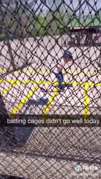 Dumbass kid walks in front of automatic pitcher