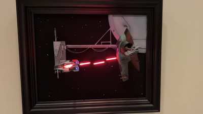 I wanted to make a diorama that I could hang on a wall. I used black 3.0 to hide the standoffs and LED filaments for the lasers.