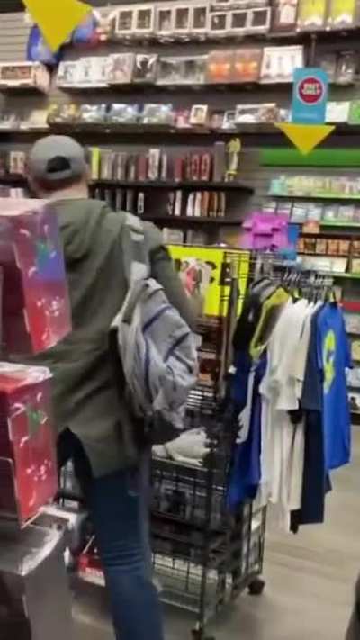 Man throws Red Bull in cashiers face because he couldn’t sell his game…