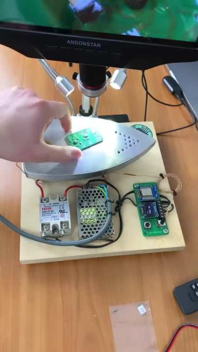 Filming the creation of a circuit board though a microscope