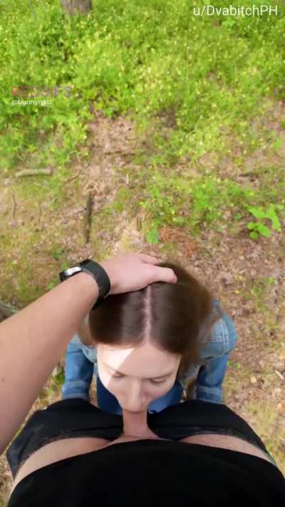 In the woods pushing my head deeper till I gag on his cock