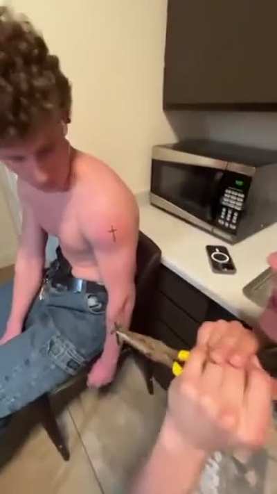 Idiots brand themselves with a cross