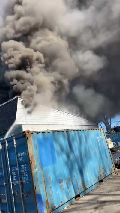 Structure fire in mechanic/tire company.