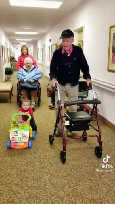 Baby and Great Grandpa have a race with their walkers