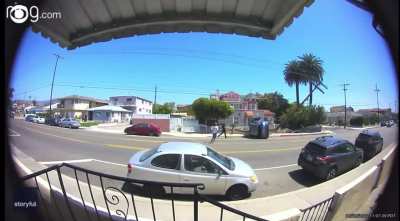 One van doesn’t give right-of-way to another van at an intersection in an Los Angeles Neighborhood, which causes it to veer onto the sidewalk, slam into a streetlight and utility pole, and flip onto its side