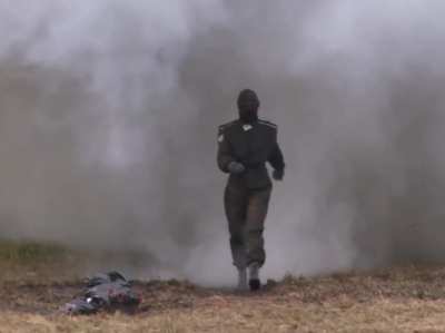 Russian combat suit tested. Walking through explosions.