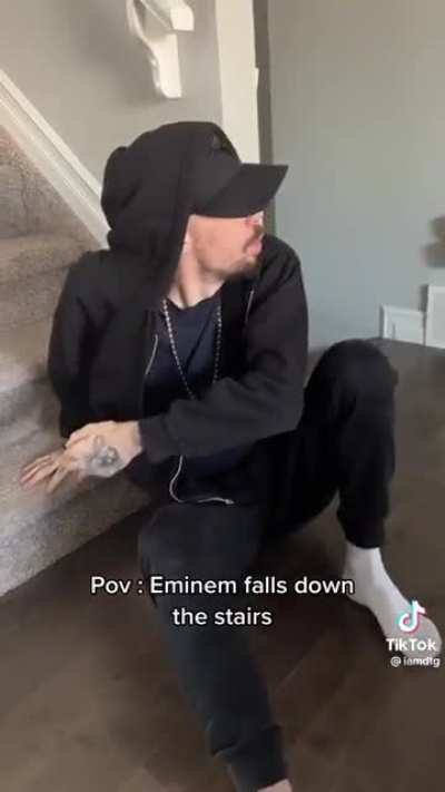Eminem falls down the stairs