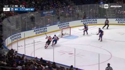 Matthew Schaefer shows off his goalie skills