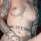 Tattooed white slut cums on a black dick
