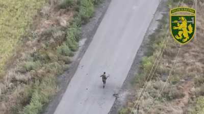 Russian soldier gets chased by an armed FPV drone, catches it unexploded and then drops it for a lethal outcome