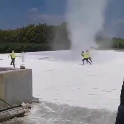 Workers scaring off a tornado