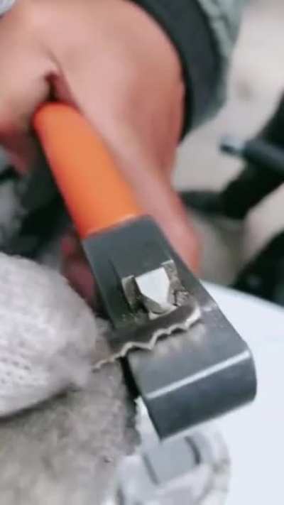 Cutting a key manually by feeling the pin positions in the lock