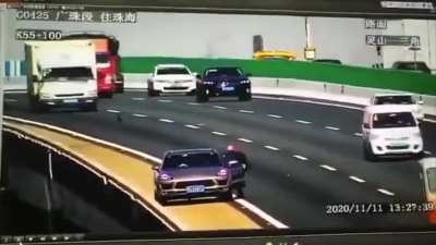 Car falls off overpass after getting struck by out of control truck in China