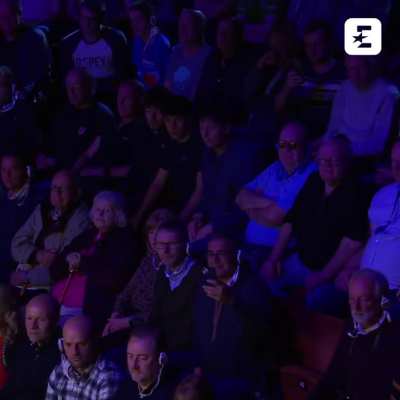 Protesters disrupt a snooker match during the World Championship by jumping on the table and covering it in an orange powder
