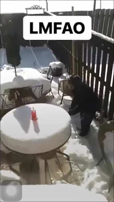 A dad having fun cutting and eating a snowcake