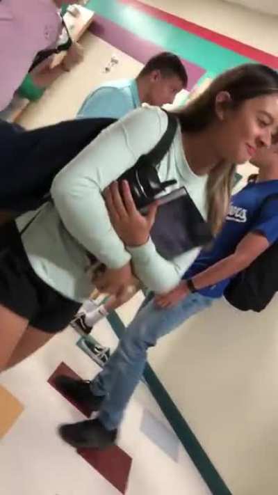 My buddy, guy with backpack, gets in a fight that was more of a weird hug wrestle.