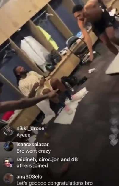 Cam Payne and Deandre Ayton dancing after the game.