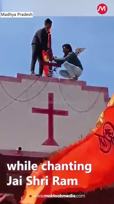 Right wing Hindu nationalists climbing on top of the Holy Cross church yesterday and planting the Hindu nationalist flag while chanting the religious slogan “Jai shri ram” Victory to Lord Ram as the church congregants were finishing their Sunday service