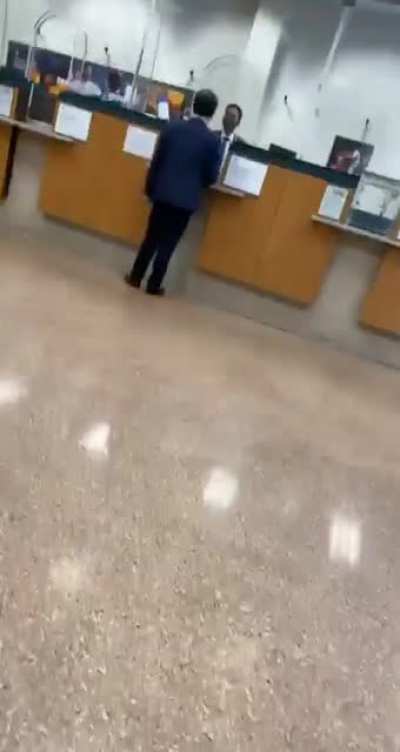guy in a suit freaks out because he didn’t like the way the lady at the bank window said “how can i help you”