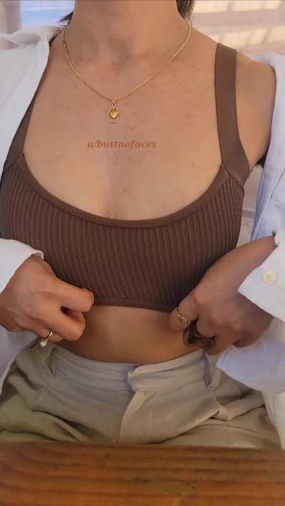 Clothed but adjusting my top 