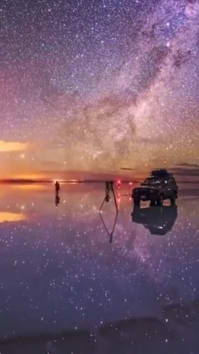 Night sky reflection on world's largest natural mirror timelapse