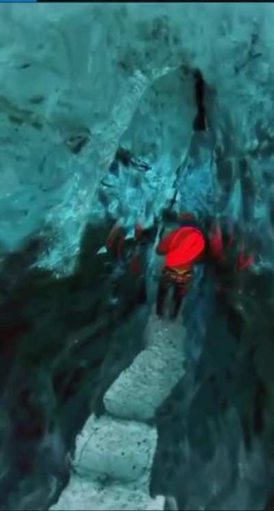 Waking through an ice cave on a glacier
