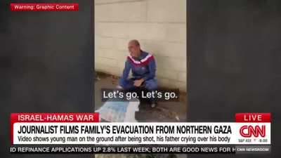 CNN Report. A Palestinian father in Gaza follows Israeli occupation forces’ instructions and leaves his home holding a white flag. His son, who’s coming with him, is shot in the head by the Israeli forces.