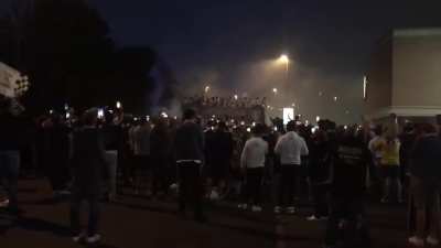 Players Celebrate on Open Top Bus Outside Elland Road
