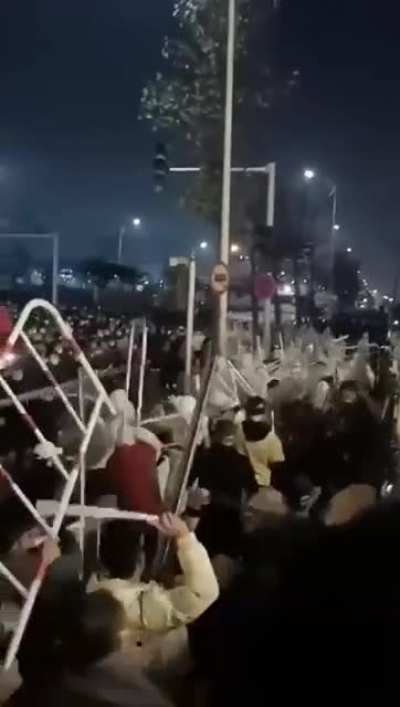 Chinese police beaten back by Foxconn workers who are protesting bad Covid lockdown conditions and no wages